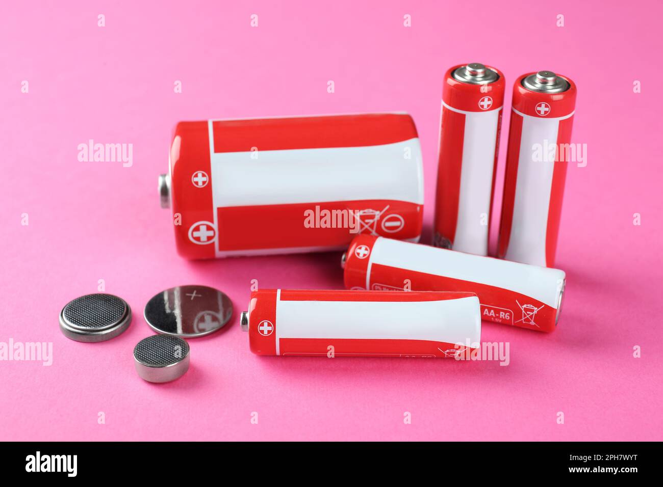 Different types of batteries on pink background Stock Photo Alamy