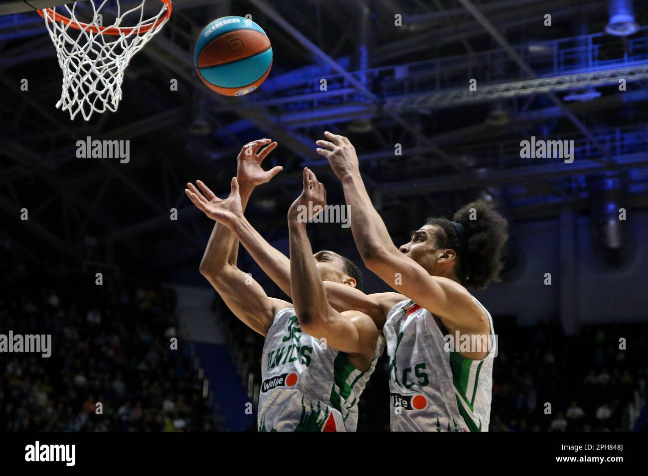 Saint Petersburg, Russia. 26th Mar, 2023. Vince Hunter (No.32) and Louis  Labeyrie (No.7) of UNICS Kazan seen in action during the VTB United League  basketball match, Second stage, between Zenit Saint Petersburg