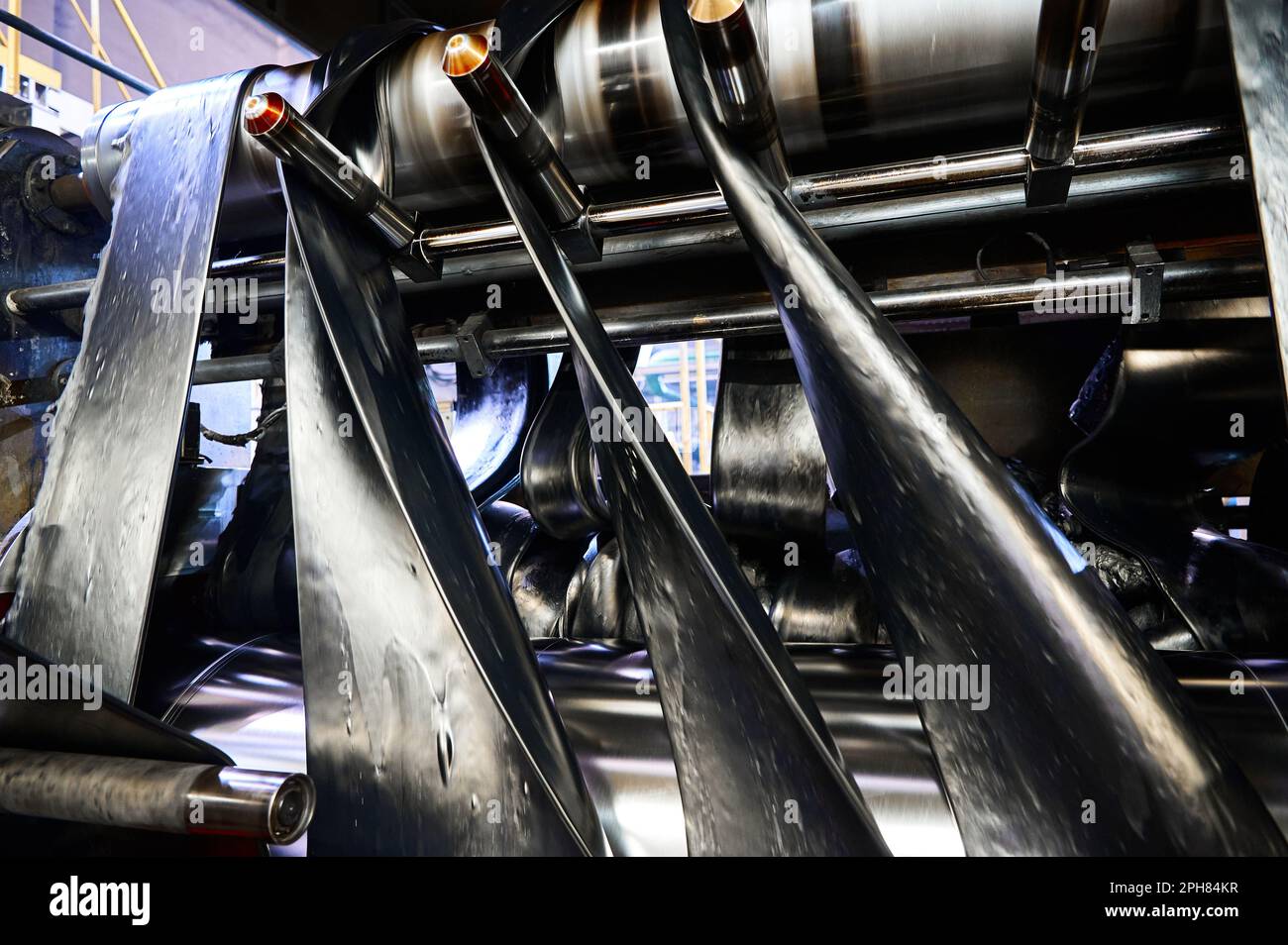 Roller Compacted Ribbons Black rubber ribbons rolled by tool at compound calendering Stock Photo ...