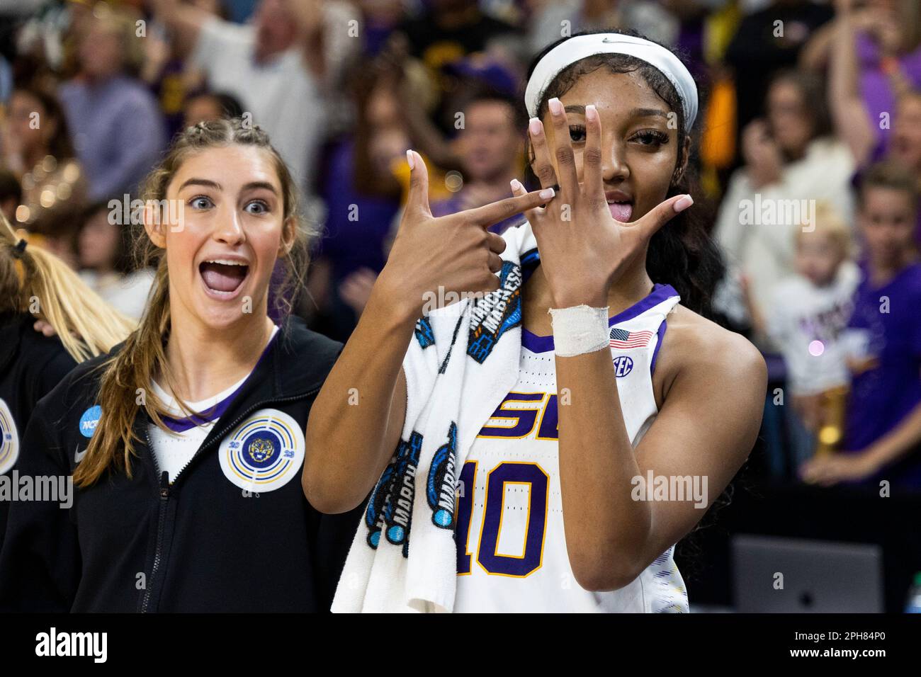 LSU's Angel Reese (10) points to her ring finger moments before