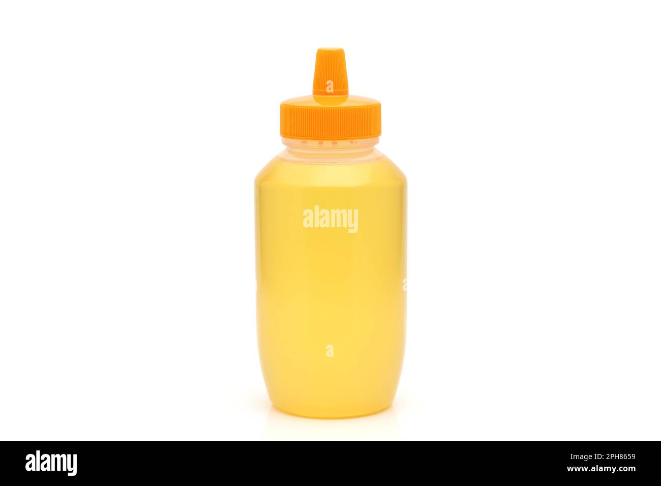 Plastic bottle of honey on white background Stock Photo