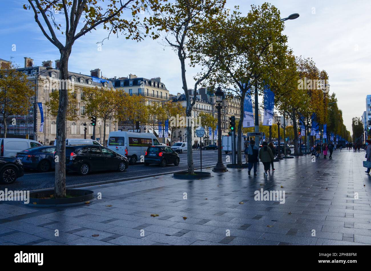 Avenue des Champs Elysees in the early morning. High-end shopping street in the 8th Arrondissement in Paris France. Stock Photo
