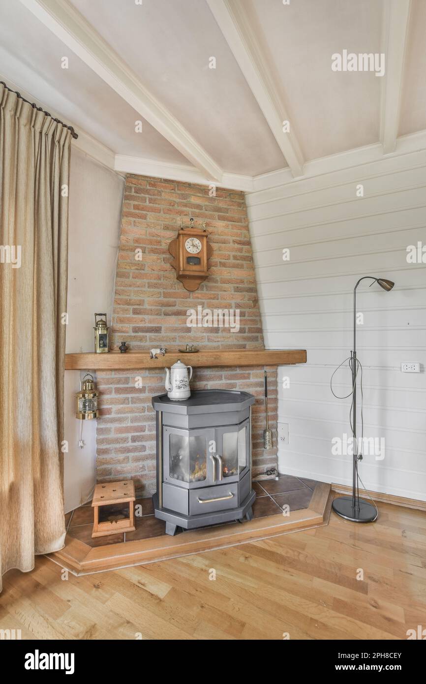 a living room with a wood burning stove in the corner and a clock on
