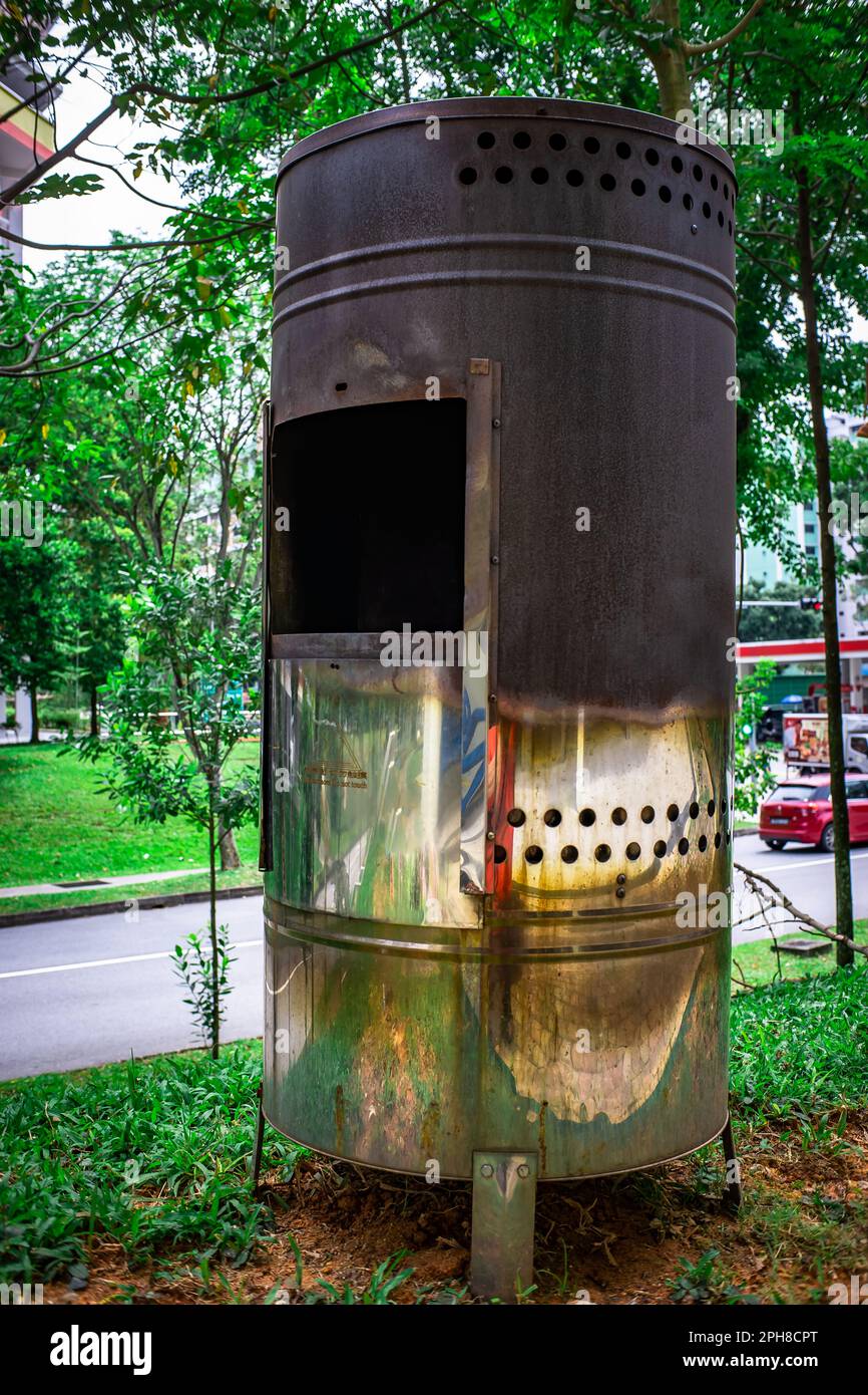 Incense Paper Burner Bin, The Stainless Steel Incense Burner in use by the Chinese residents to burn joss paper. Stock Photo