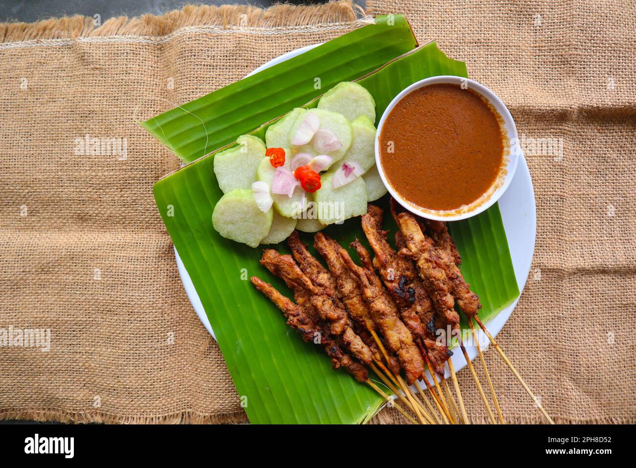 chicken satay or chicken satay served with lontong, rice cake and