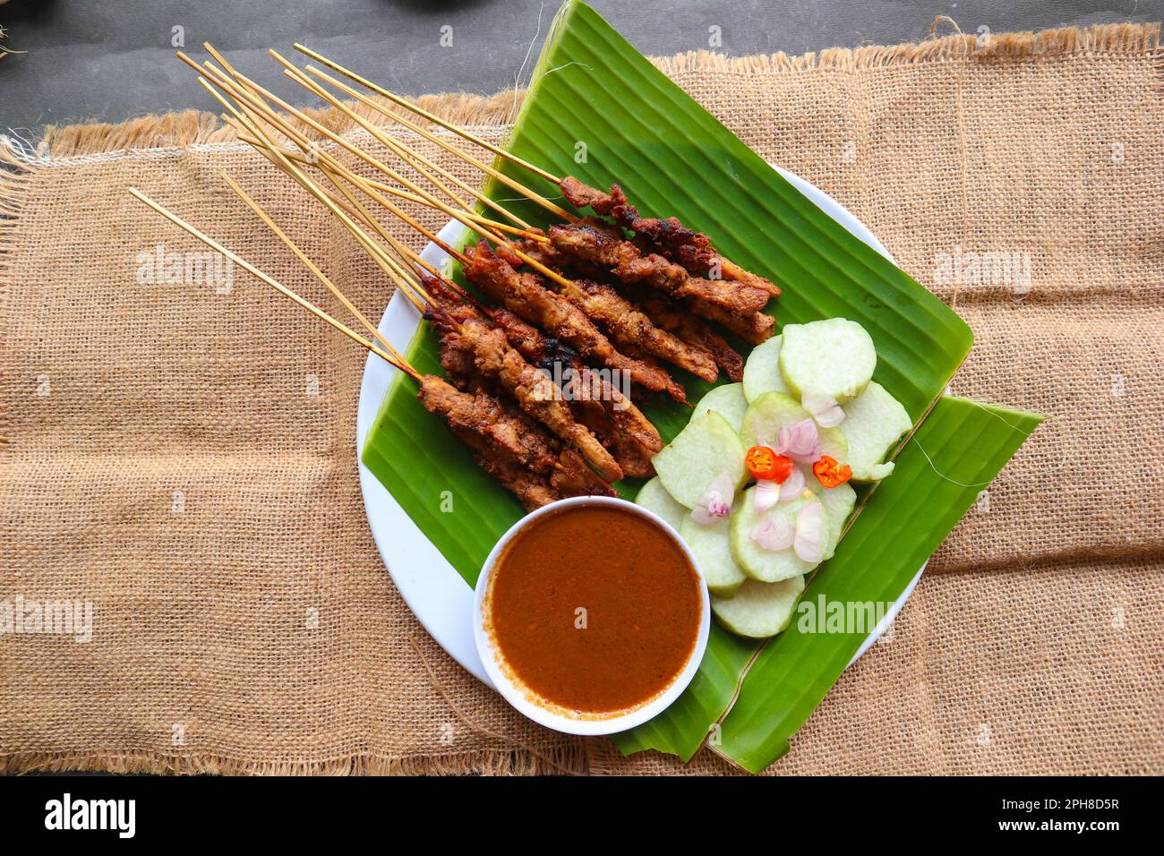 chicken satay or chicken satay served with lontong, rice cake and