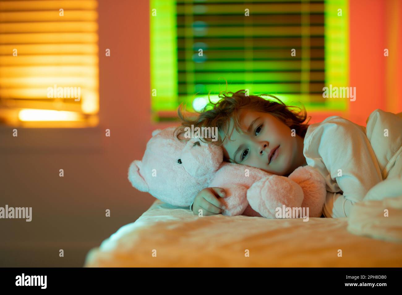 Night fall asleep of little child in bed. Kid go to sleep in the