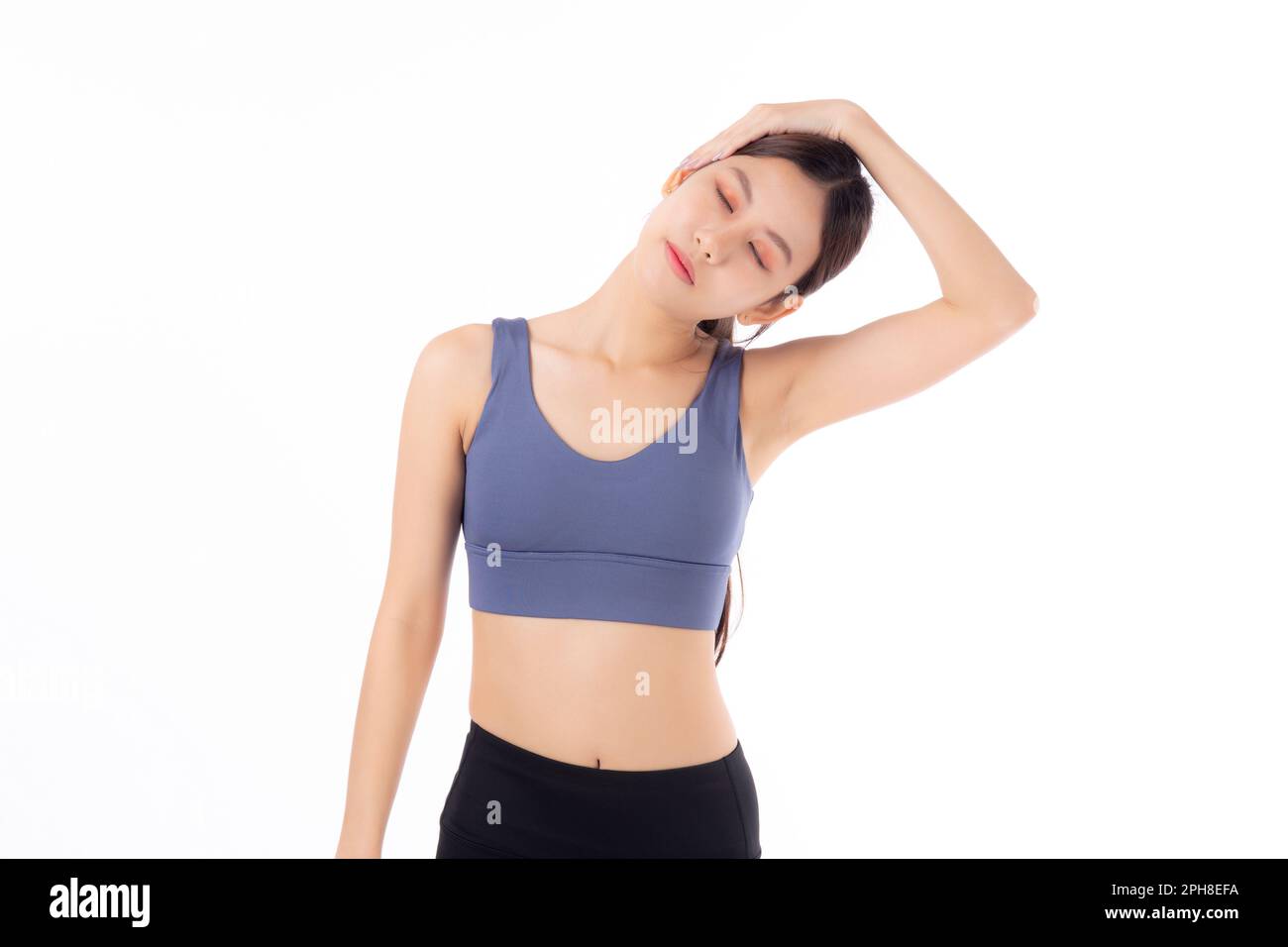 Beautiful young asian woman stretching neck with hands for exercise ...