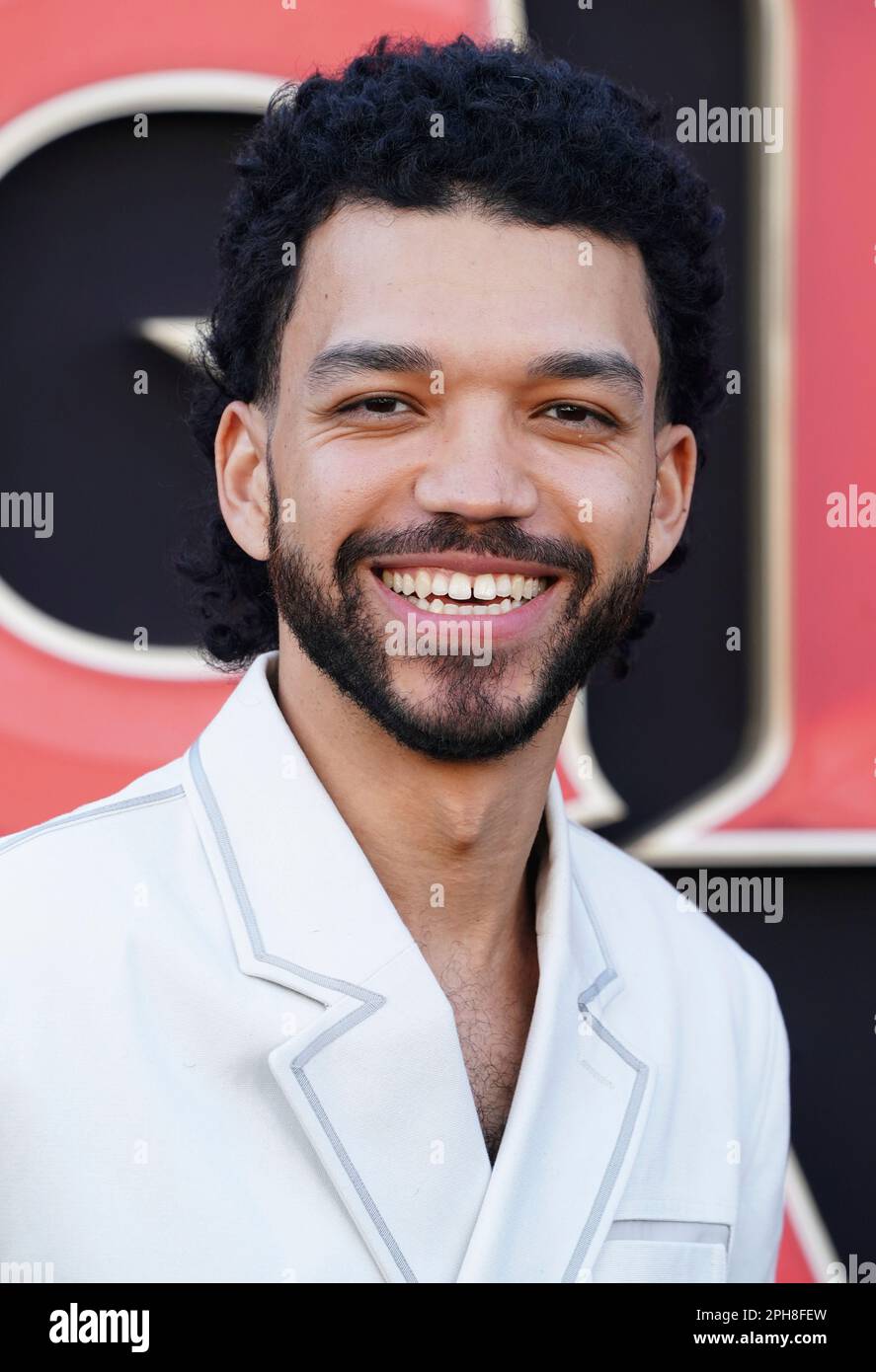 Justice Smith arrives at the Los Angeles premiere of 