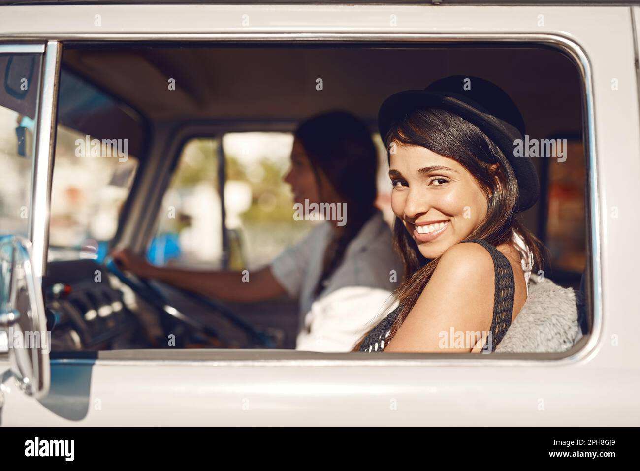 Summertime is road trip time. Portrait of a happy young woman enjoying ...