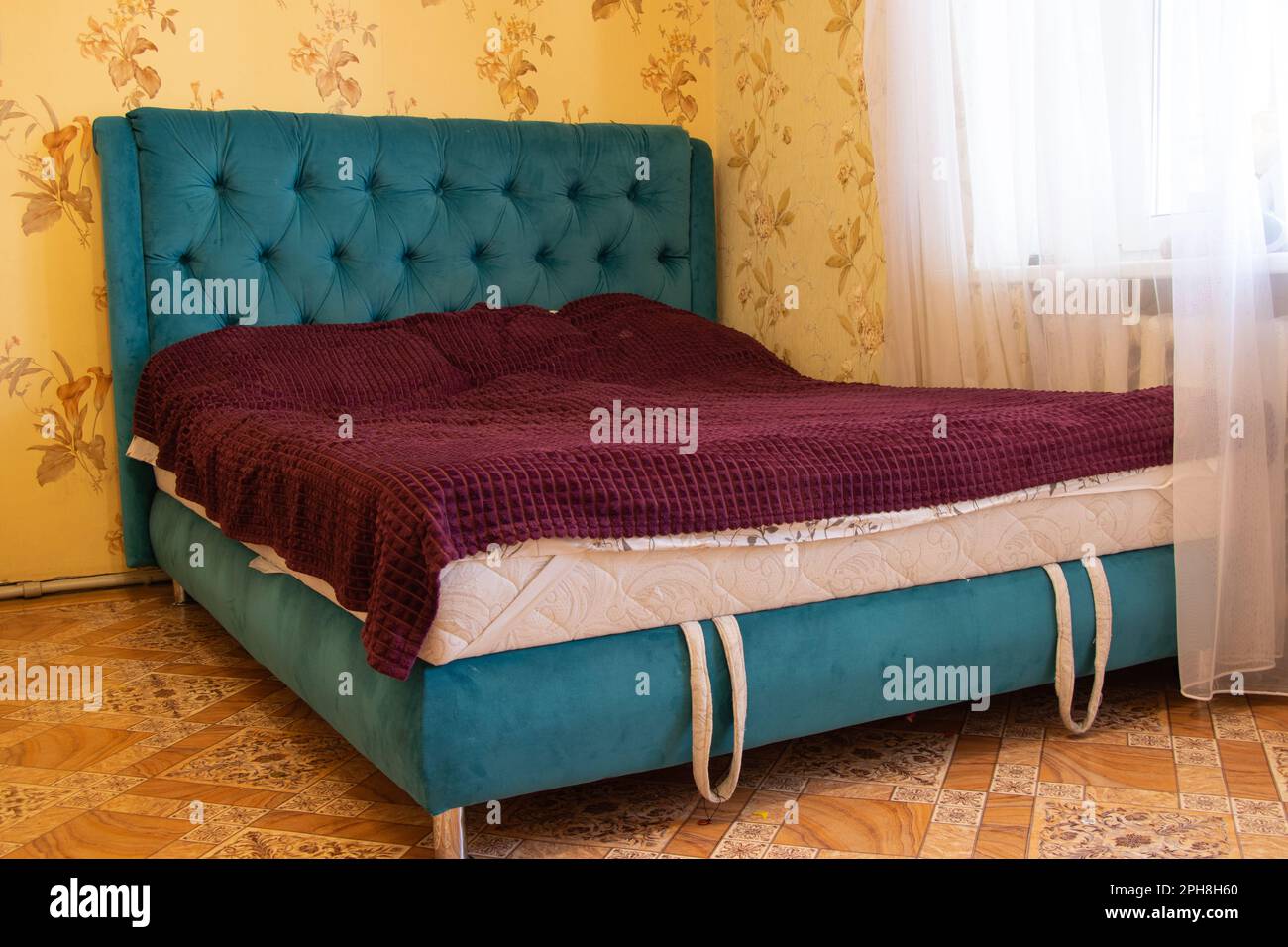 large double bed in the bedroom in the light of day Stock Photo