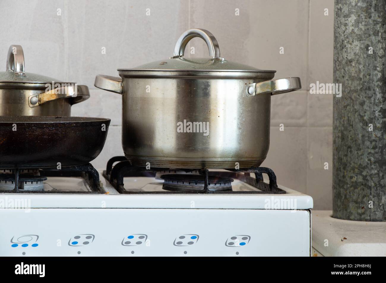 pots are on the gas stove in the kitchen at home, cook on the stove