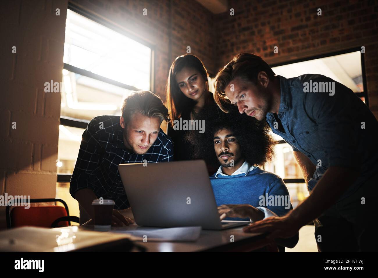 Great minds think alike. a group of young designers having a ...