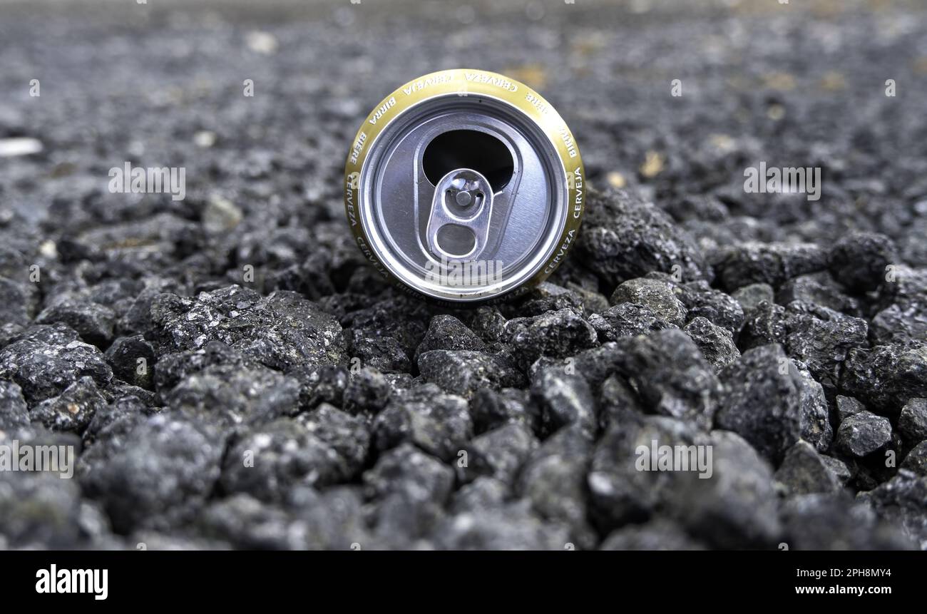 Detail of empty beer can thrown in the trash, environmental pollution Stock Photo