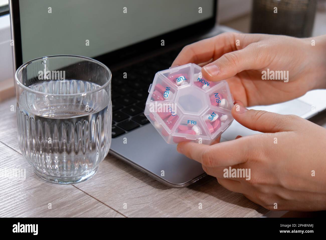 Tablets. Sort Woman sorting pills Organizer weekly shots Closeup of medical pill box ...