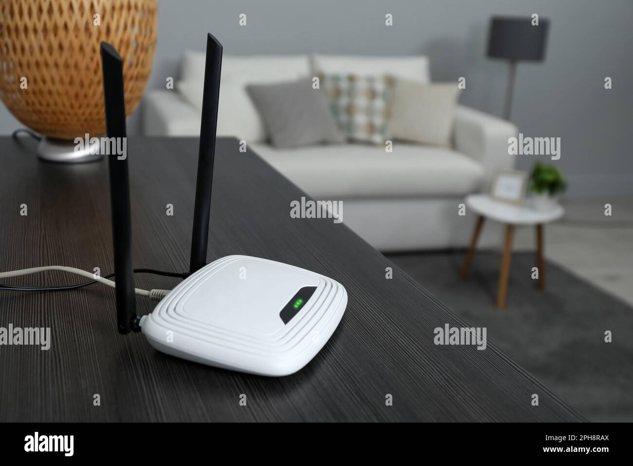 Wi-Fi router on black wooden table in room. Space for text Stock Photo ...
