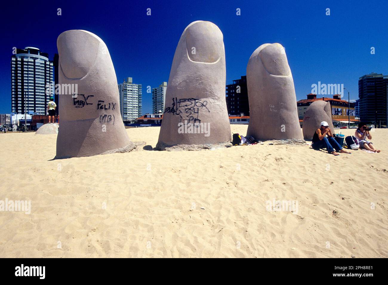 Famous finger (dedos) sculpture in sand at Playa Brava in the resort town of Punta Del Este, Uruguay, South America Stock Photo