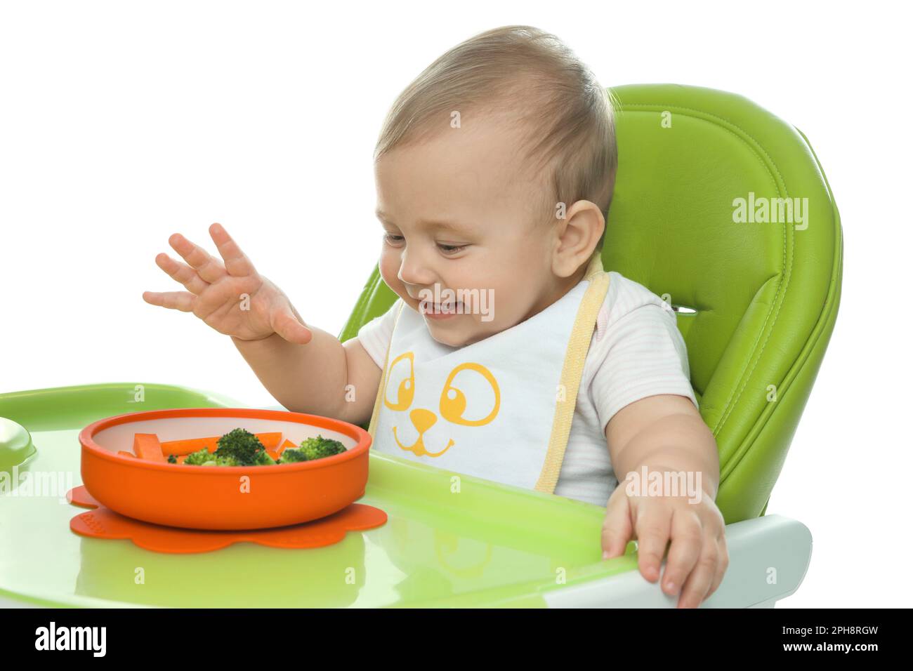 Cute little baby wearing bib while eating on white background Stock ...