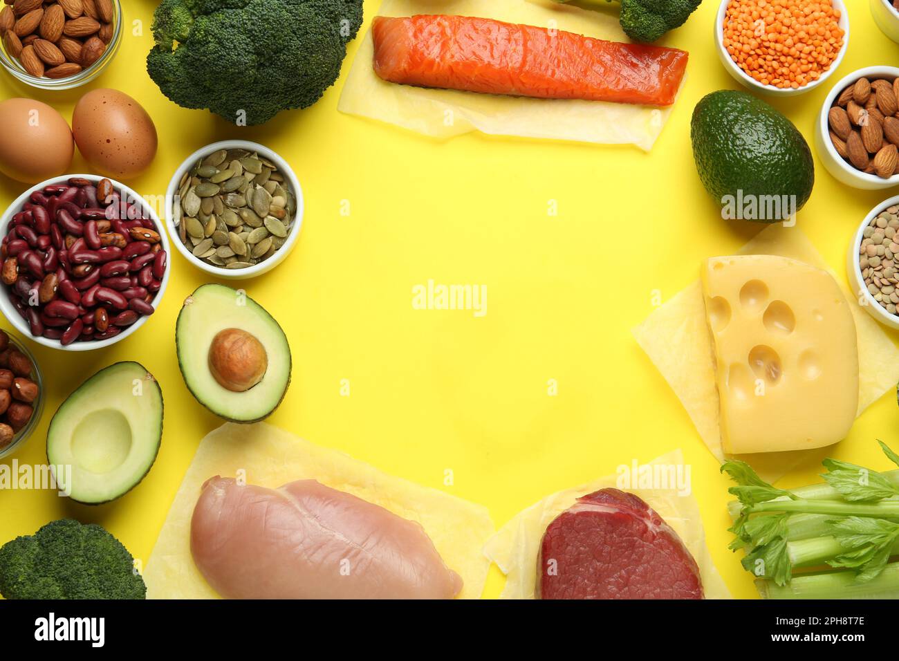 Frame of products rich in amino acids on yellow background, flat lay