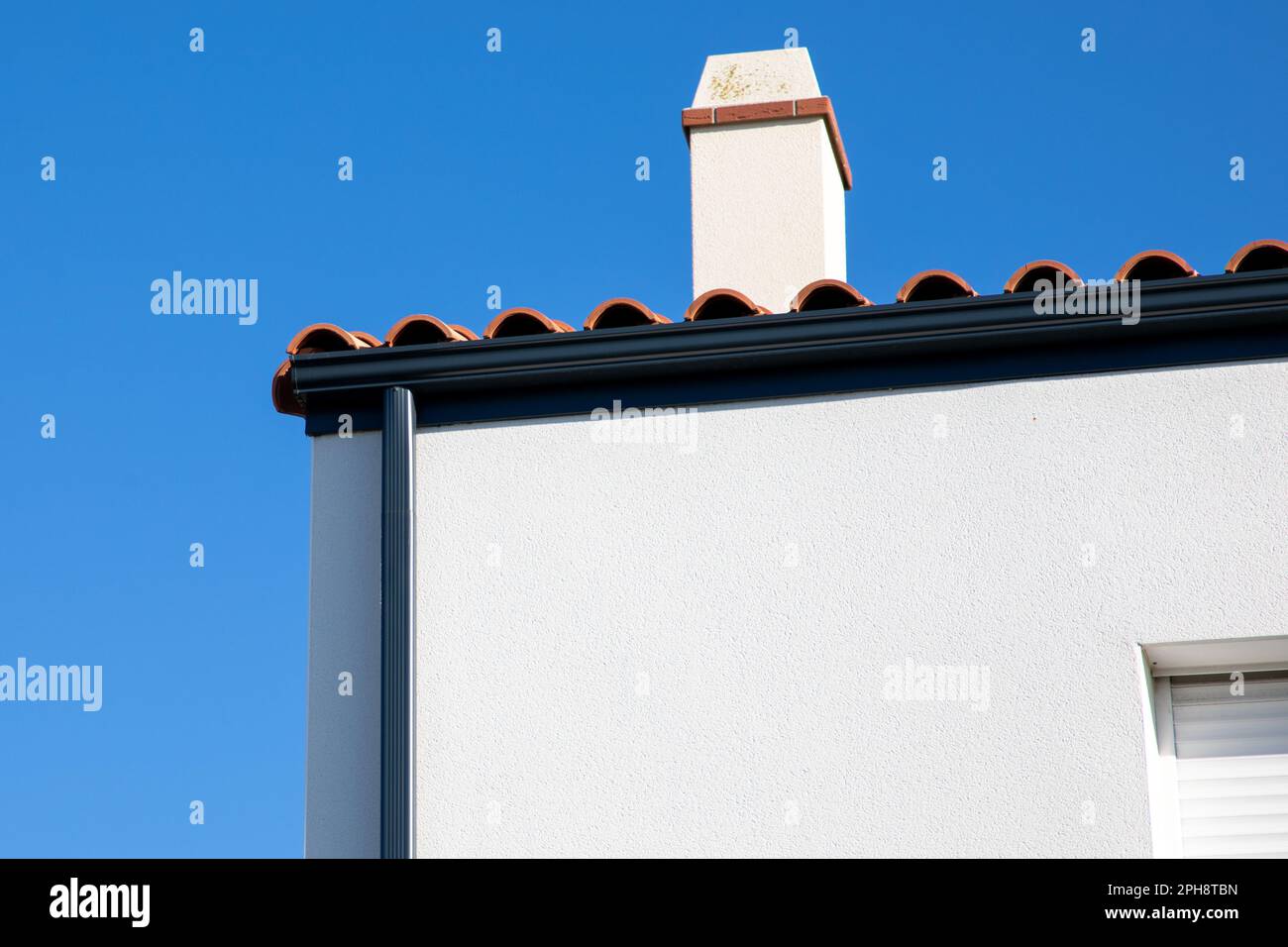 grey gutter guard system drip edge on single white family home