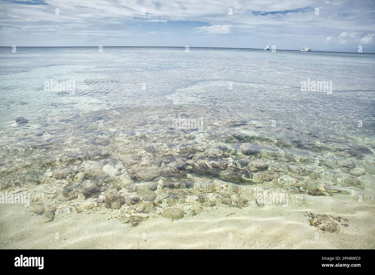 Dreamlike idyllic beach of Siquijor in the Philippines, in the foreground crystal clear sea. Stock Photo