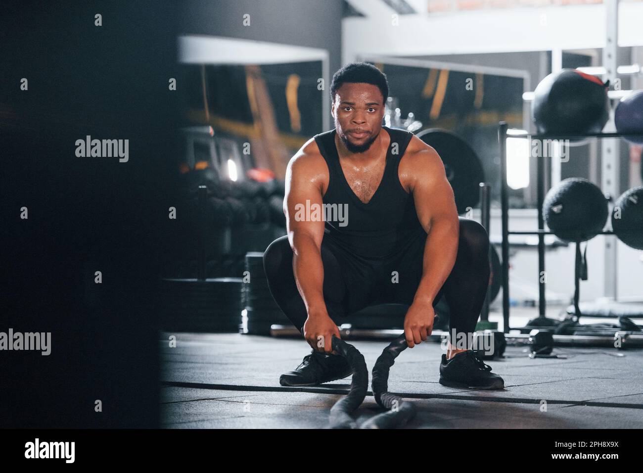 Strong african american man in sportive clothes have workout day in the ...