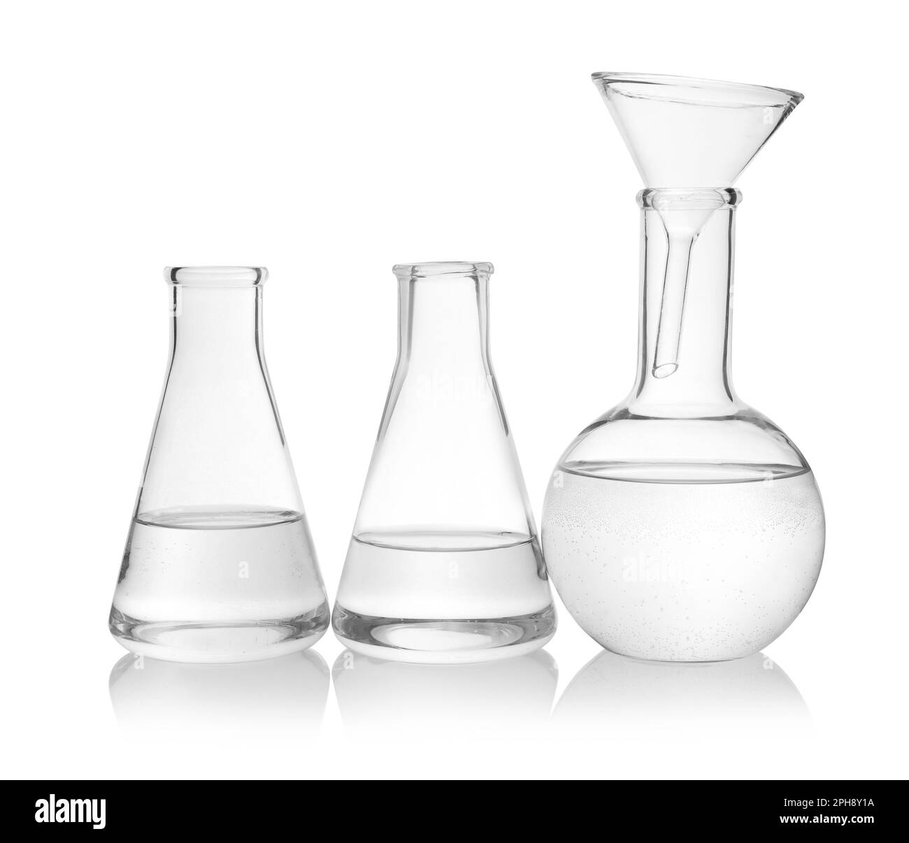 Laboratory glassware with transparent liquid on white background Stock ...
