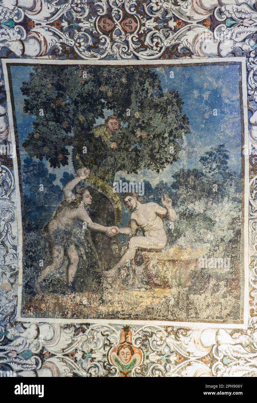 Fuente del Arco - Spain - Nov 1st, 2022: Fresco paintings vault at Chapel of Our Lady of Ara, Fuente del Arco, Spain. Eve and the serpent on tree life Stock Photo