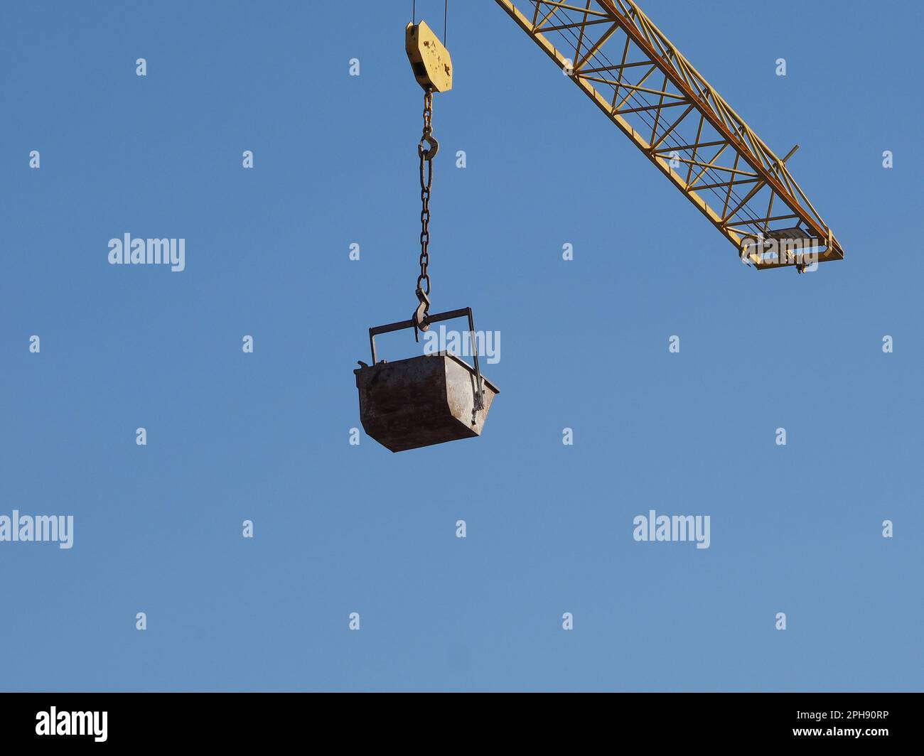 bucket attached to the lifting hook of a crane Stock Photo Alamy