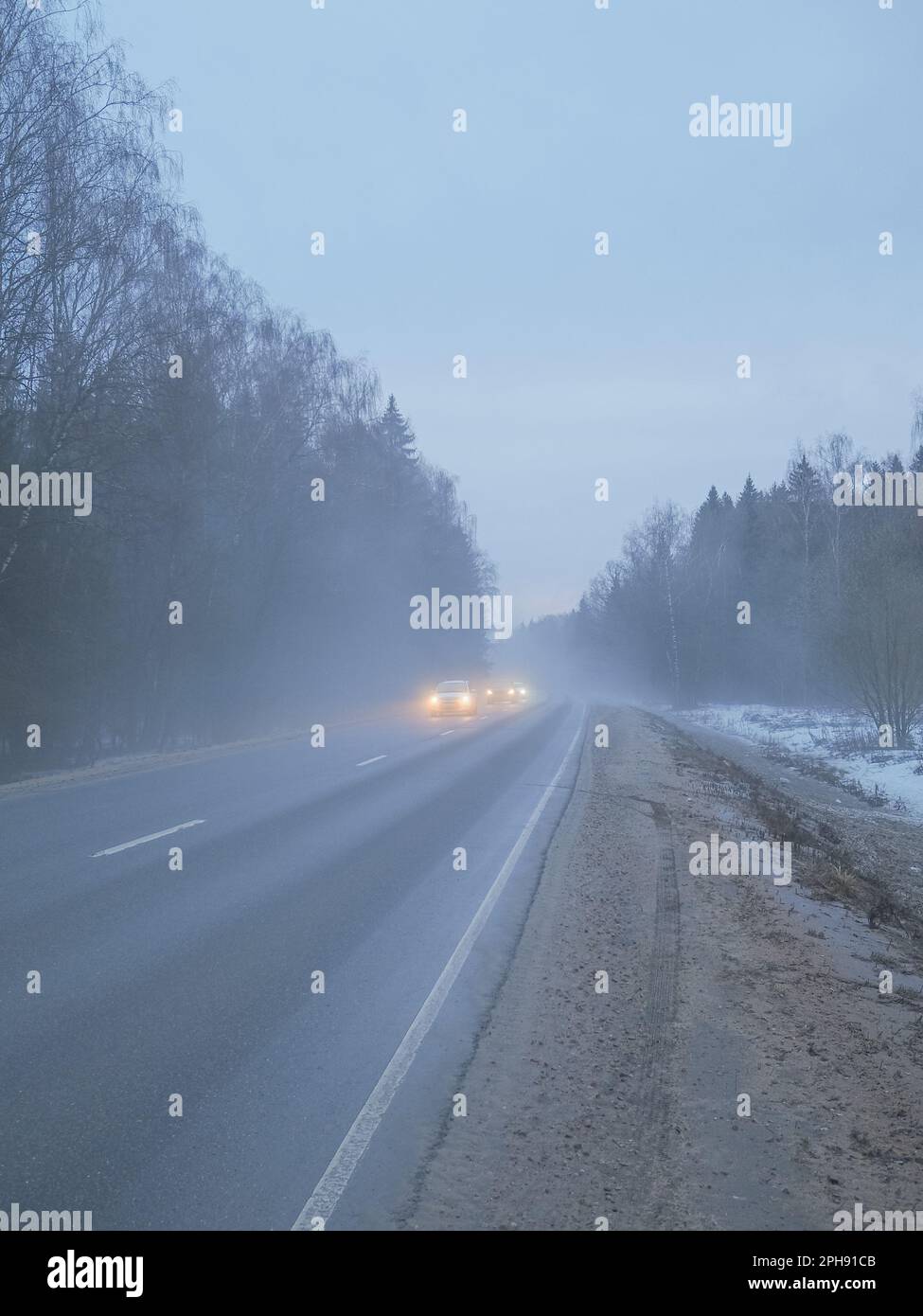 Driving on foggy suburban road hi-res stock photography and images - Alamy