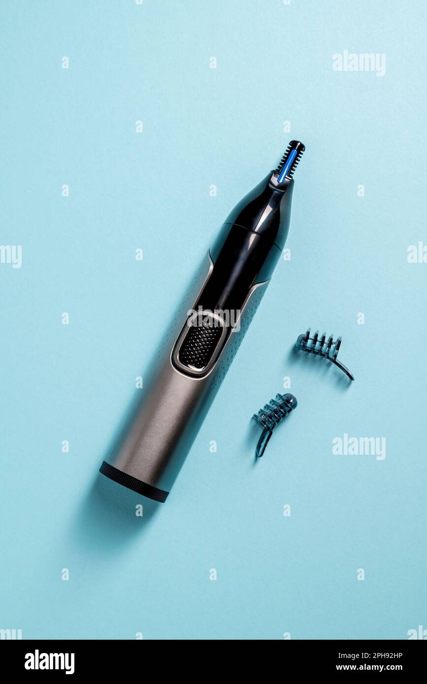 Top view of nose and ear hair trimmer isolated on blue background Stock Photo