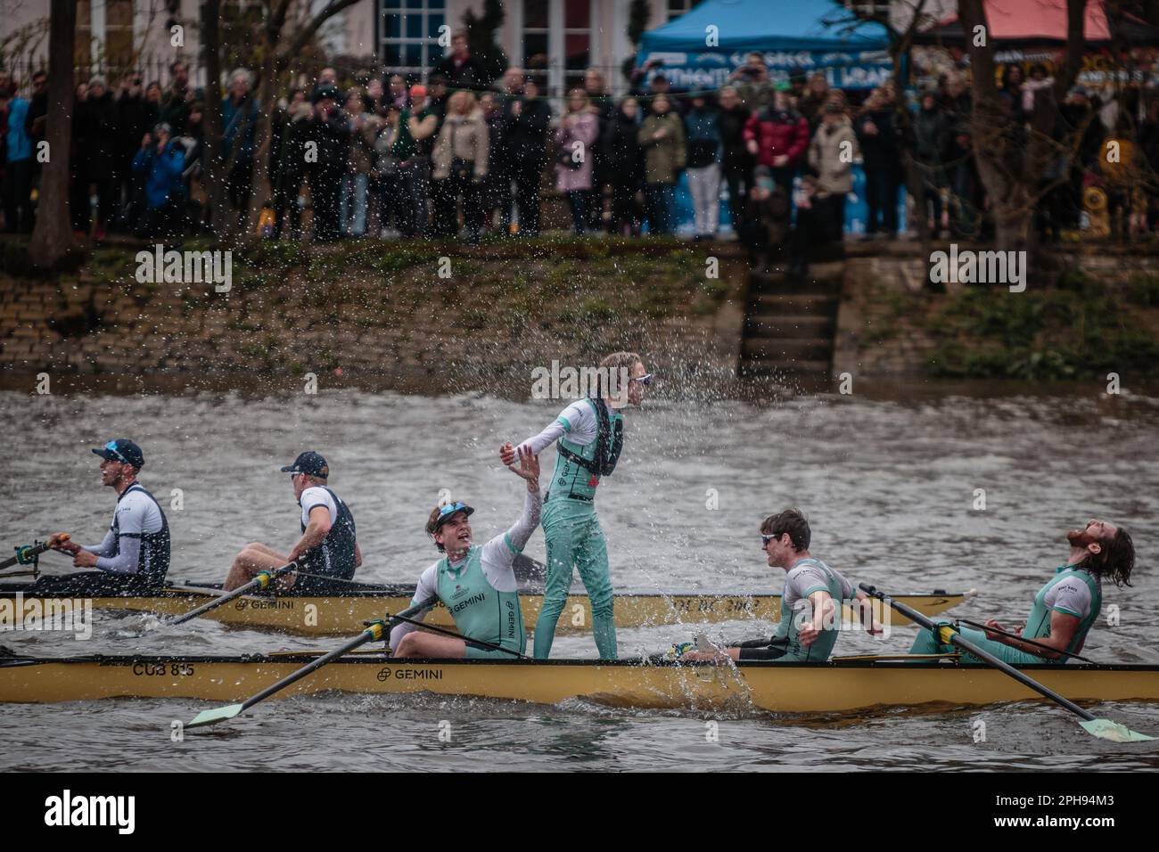 The cox stands tall after victory for Cambridge at the Gemini Oxford v Cambridge Boat Race London 2023 Stock Photo