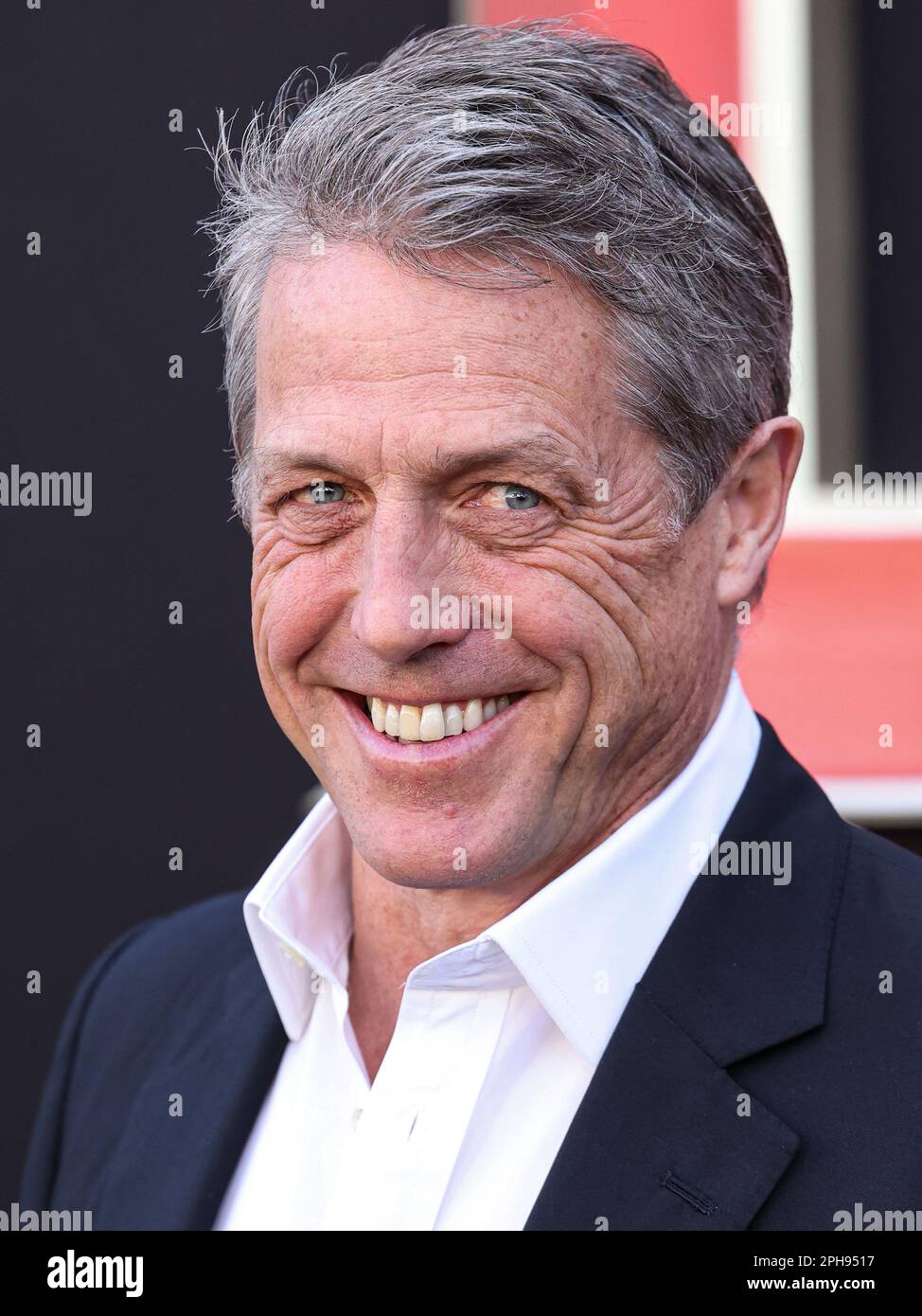 WESTWOOD, LOS ANGELES, CALIFORNIA, USA - MARCH 26: English actor Hugh Grant arrives at the Los Angeles Premiere Of Paramount Pictures' and eOne's 'Dungeons & Dragons: Honor Among Thieves' held at the Regency Village Theatre on March 26, 2023 in Westwood, Los Angeles, California, United States. (Photo by Xavier Collin/Image Press Agency) Stock Photo