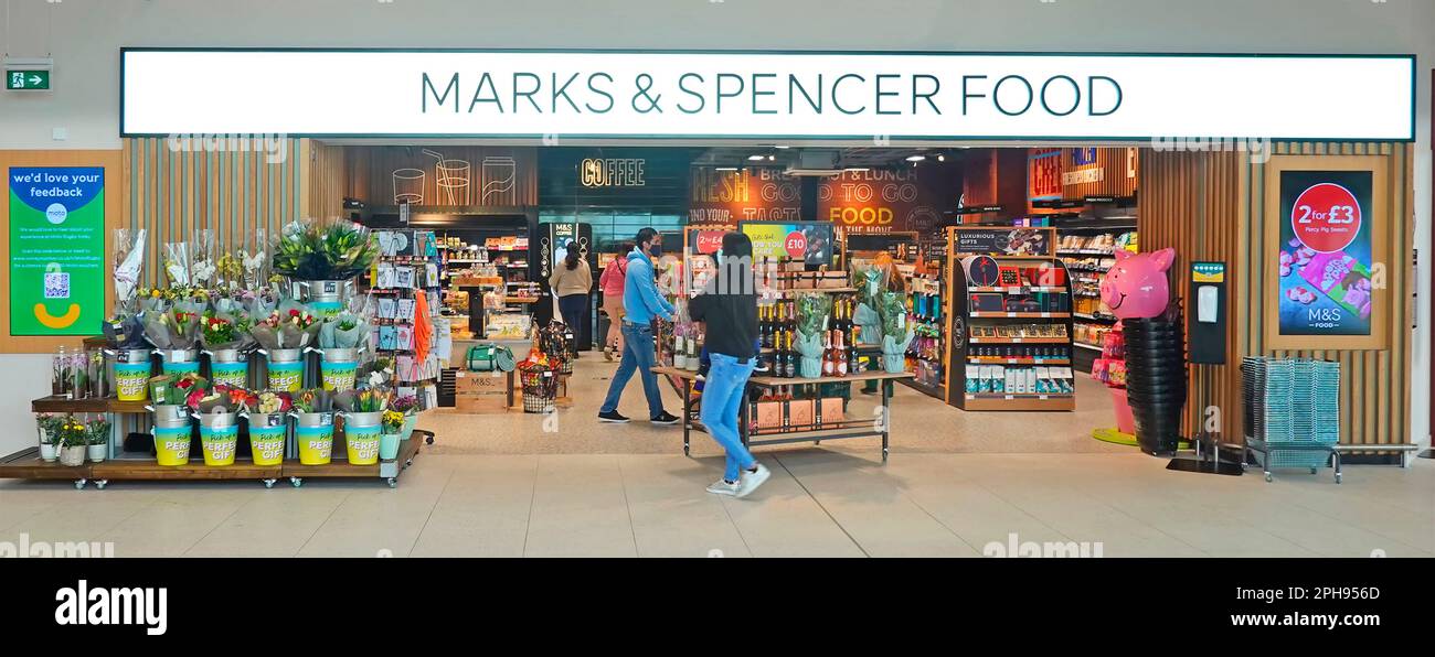 Marks & Spencer food shop front & sign at new 2021 Moto Rugby M6 motorway services shopping mall shoppers in Covid face masks Warwickshire England UK Stock Photo