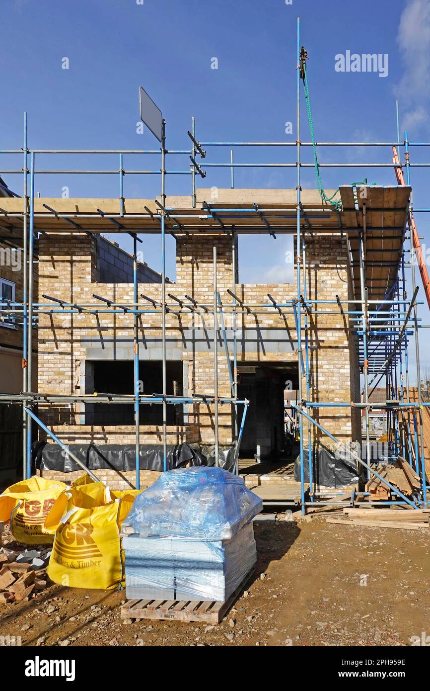 Front door & window openings formed in facing brick cavity walls on ...
