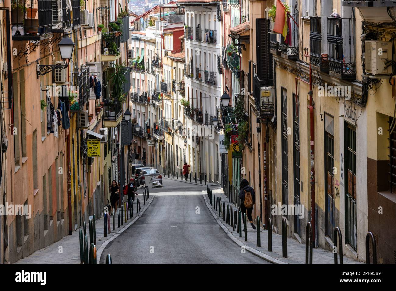 Looking down the calle de Buenavista which leads into the popular, multicultural district of Lavapies, in the center of Embajadores, central Madrid, S Stock Photo