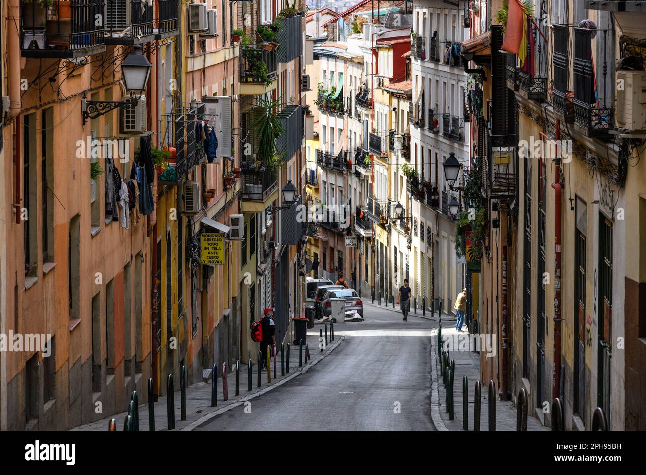 Looking down the calle de Buenavista which leads into the popular, multicultural district of Lavapies, in the center of Embajadores, central Madrid, S Stock Photo