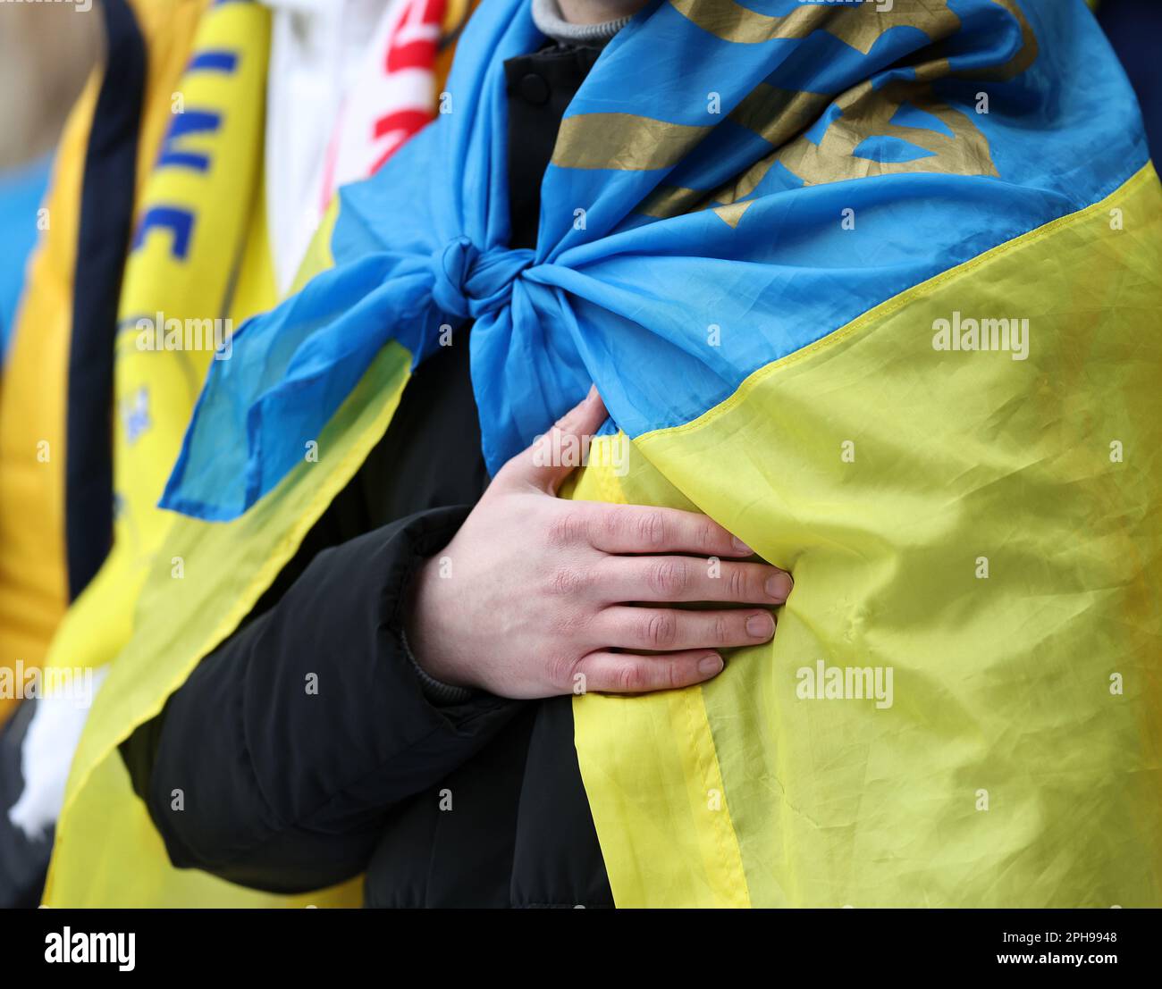 London, UK. 26th Mar, 2023. A Ukranian fan during their national anthem during the UEFA European Championship Qualifying match at Wembley Stadium, London. Picture credit should read: David Klein/Sportimage Credit: Sportimage/Alamy Live News Stock Photo