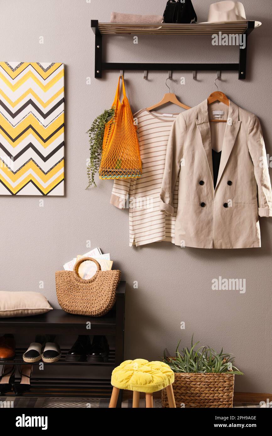 Hallway interior with stylish furniture, clothes and accessories Stock ...