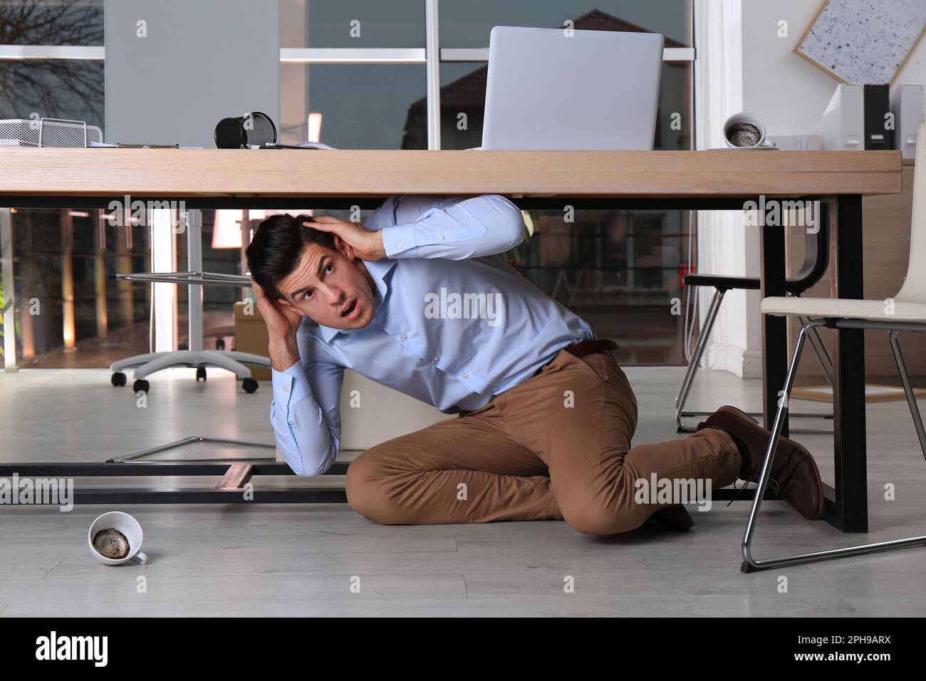 Hiding Under Desk Office Worker