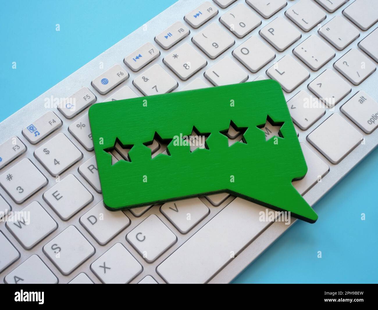 Keyboard and plate with five stars for review Stock Photo Alamy