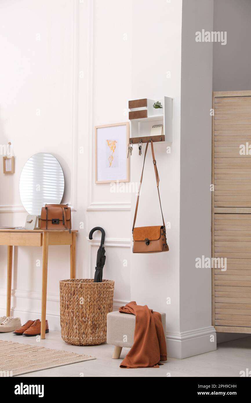 Modern hallway interior with stylish dressing table and key holder Stock Photo Alamy