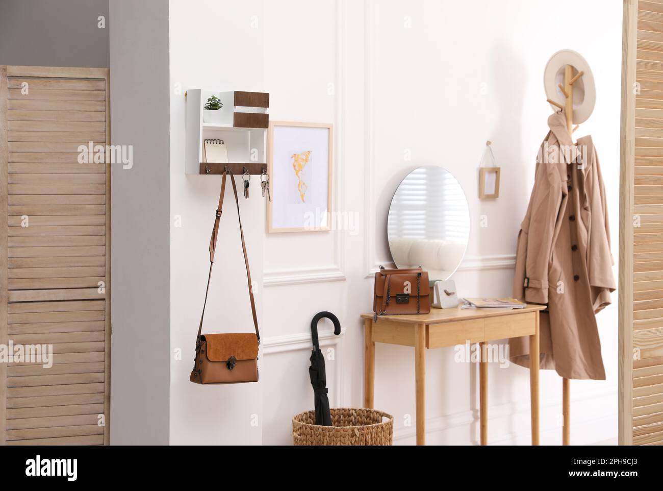 Modern hallway interior with stylish dressing table and key holder Stock Photo Alamy