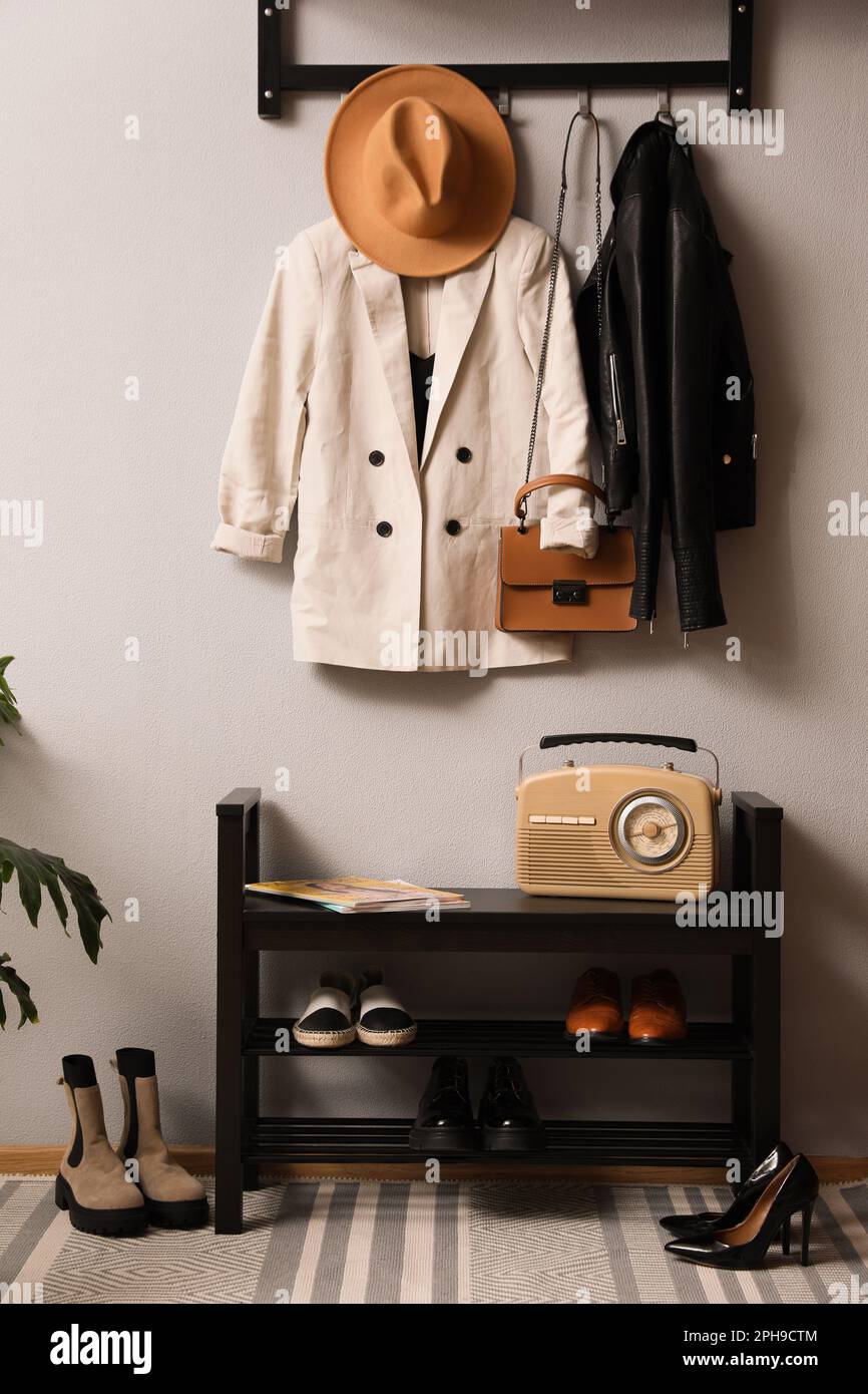 Hallway interior with stylish furniture, clothes and accessories Stock ...