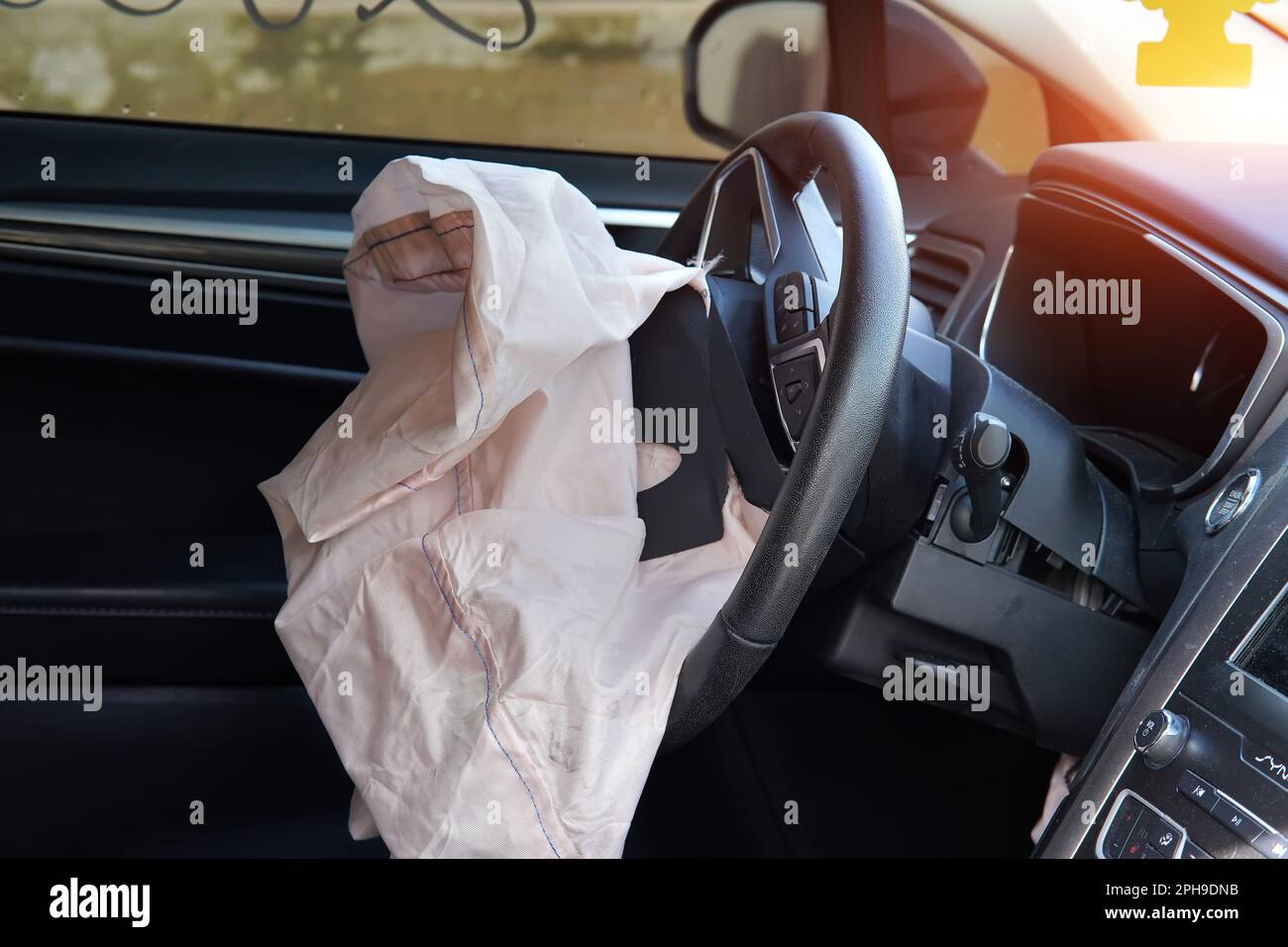 triggered airbag on the steering wheel of the car Stock Photo Alamy