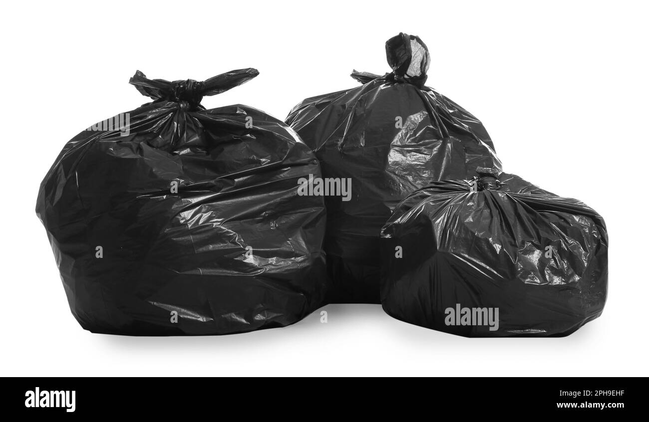 Black trash bags full of garbage on white background Stock Photo Alamy
