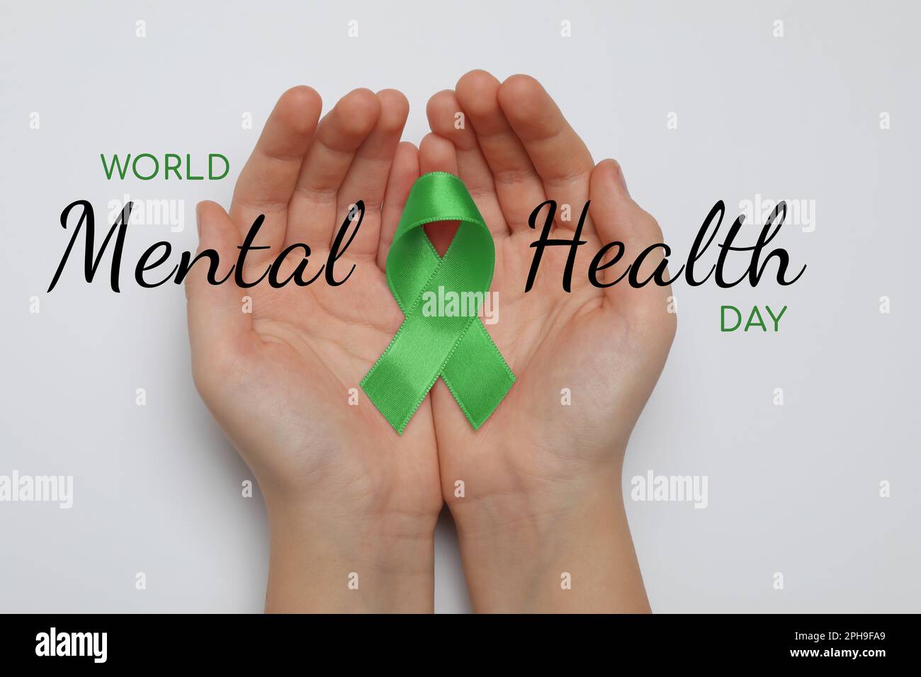 World Mental Health Day. Woman holding green ribbon on white background