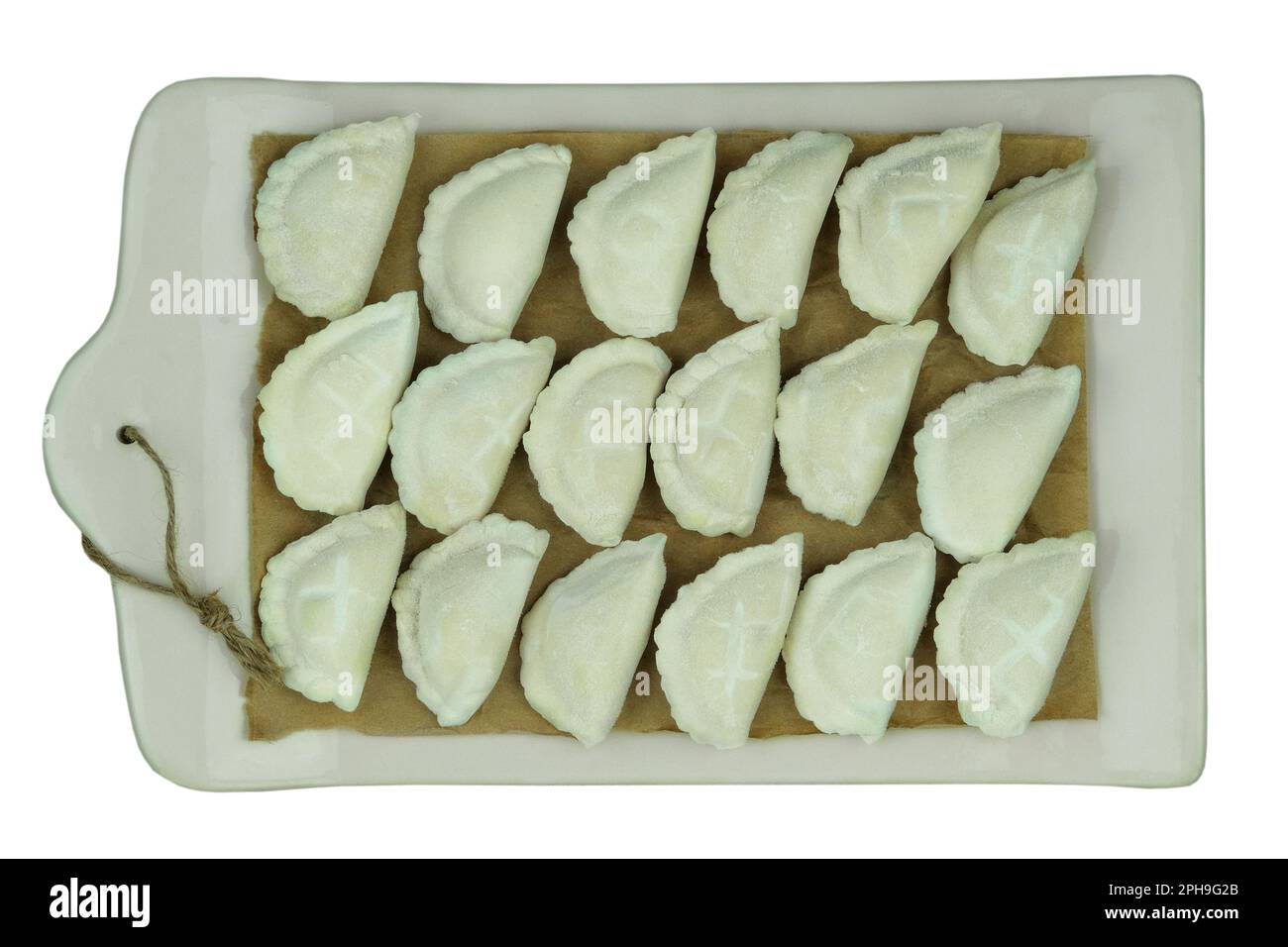 Dumplings with potatoes on the kitchen board. Dumplings with potatoes is a traditional Ukrainian dish. Home cooking. Stock Photo