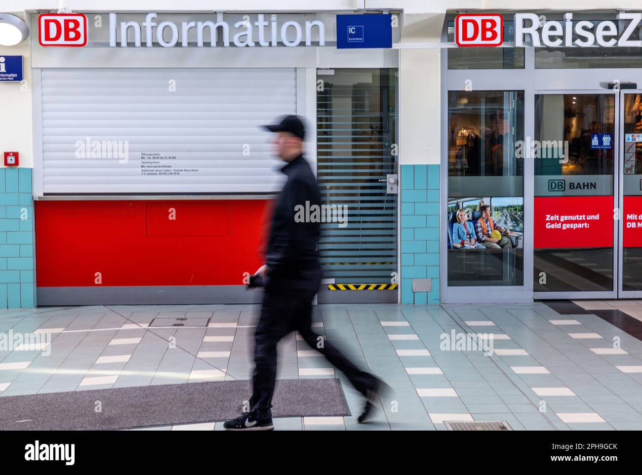 Schwerin, Germany. 27th Mar, 2023. A man walks past the closed information desk of Deutsche Bahn
