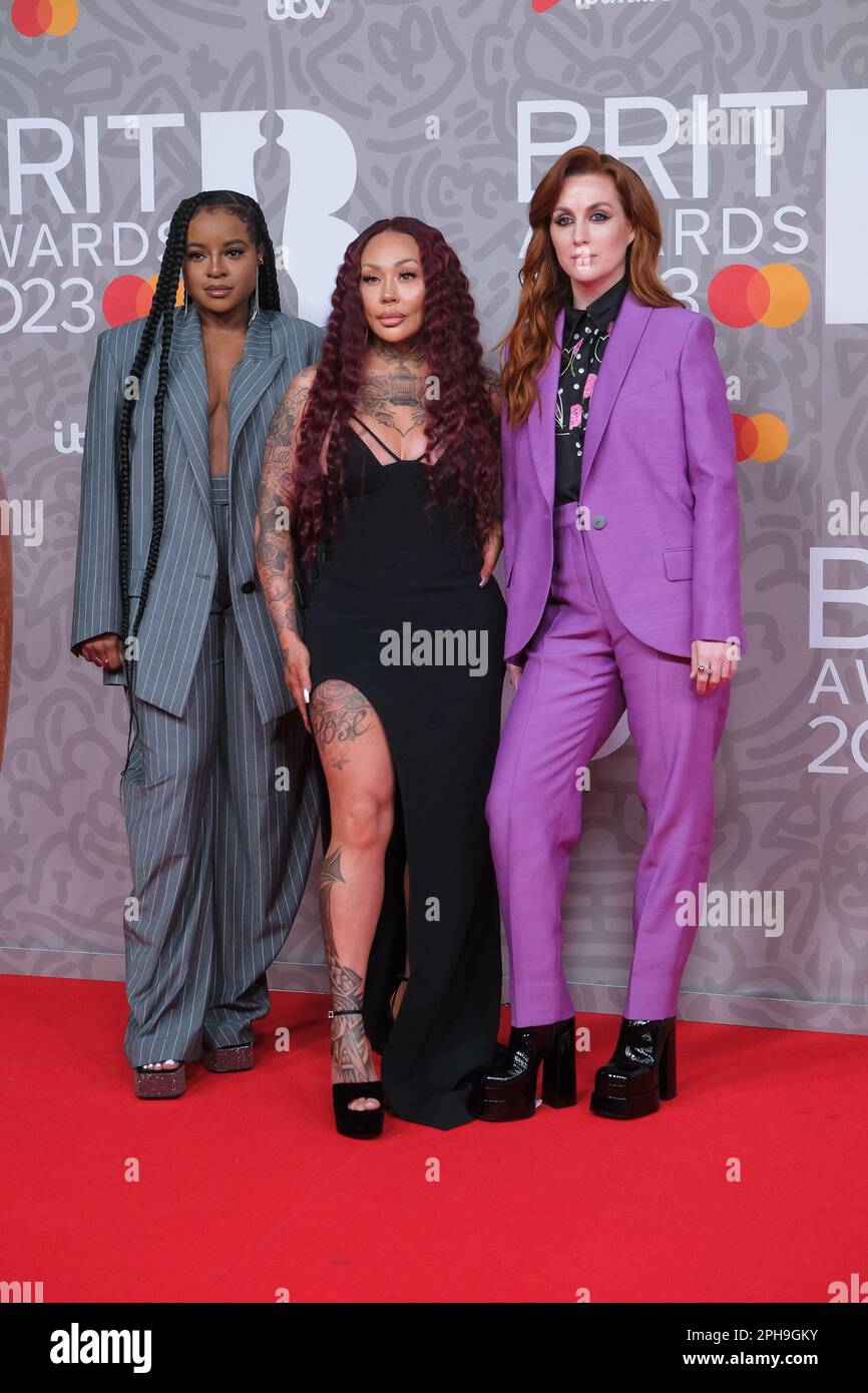 Mutya Buena, Keisha Buchanan And SiobháN Donaghy Of Sugababes photographed attending The BRITS Red Carpet Arrivals at The O2 in London, UK on 11 February 2023 . Picture by Julie Edwards. Stock Photo
